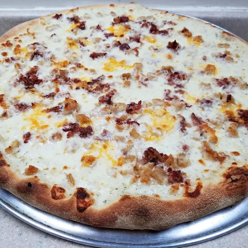 A white pizza with bacon