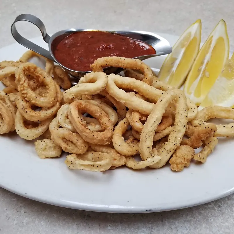 Fried calamari with marinara and a lemon wedge